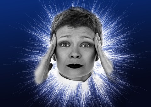 woman with hand on head